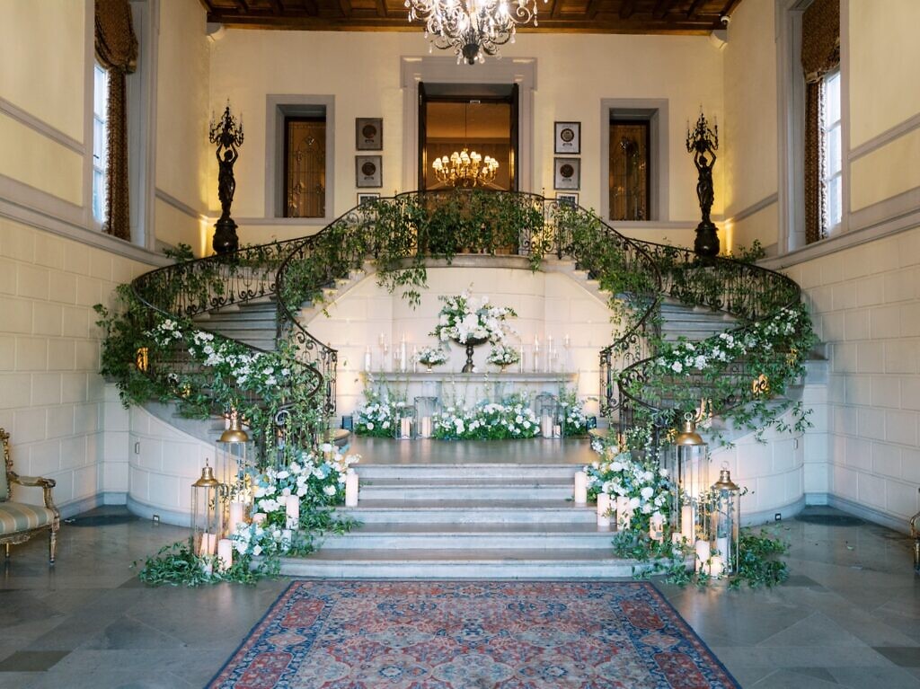 Entry stairs covered in flowers at an Oheka Castle wedding.